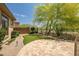 Backyard features artificial turf, travertine patio, desert landscaping and walkway lights to be enjoyed day or night at 41903 N Golf Crest Rd, Anthem, AZ 85086