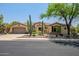 Inviting single-story home featuring beautiful desert landscaping and a charming tile roof at 41903 N Golf Crest Rd, Anthem, AZ 85086