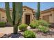 Stunning front entrance with native desert landscaping and a welcoming front door at 41903 N Golf Crest Rd, Anthem, AZ 85086