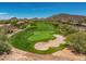 Stunning golf course view featuring lush green fairway, manicured sand traps and mountain views at 41903 N Golf Crest Rd, Anthem, AZ 85086