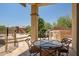 Covered patio featuring a built-in outdoor grill, an outdoor seating area, and a view of the pool at 41903 N Golf Crest Rd, Anthem, AZ 85086