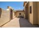 Outdoor patio with space for dining and a decorative wall feature with tile roofing at 41903 N Golf Crest Rd, Anthem, AZ 85086