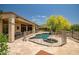 Backyard oasis features a fenced pool and spa, perfect for relaxing and entertaining at 41903 N Golf Crest Rd, Anthem, AZ 85086