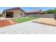 Private backyard featuring a lush lawn, patio, and well-maintained landscaping at 41903 W Rojo St, Maricopa, AZ 85138
