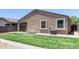 Serene backyard with artificial turf and well-kept landscaping, providing a peaceful retreat at 41903 W Rojo St, Maricopa, AZ 85138