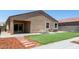 Charming backyard with green lawn, perfect for outdoor entertaining and relaxation at 41903 W Rojo St, Maricopa, AZ 85138