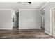 Open-concept living area with wood floors and backyard access at 41903 W Rojo St, Maricopa, AZ 85138