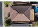 Aerial view showcasing the home's roof and layout with a fenced backyard and sparkling pool at 4413 W Phalen Dr, New River, AZ 85087