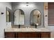 Well-appointed bathroom with double sinks, granite countertops, and a stylish walk-in shower with views at 4413 W Phalen Dr, New River, AZ 85087