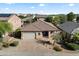 Charming single-story home featuring a tile roof, two-car garage, and manicured desert landscaping at 4413 W Phalen Dr, New River, AZ 85087