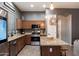 Modern kitchen with stainless steel appliances, granite countertops and island at 4413 W Phalen Dr, New River, AZ 85087