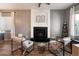 Cozy living room featuring a fireplace, modern decor, and comfortable seating for relaxing and enjoying the warmth at 4413 W Phalen Dr, New River, AZ 85087