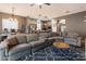 Spacious living room with an open floor plan connecting to the kitchen and dining areas, perfect for gatherings at 4413 W Phalen Dr, New River, AZ 85087