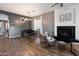 Open living room with a fireplace and lots of natural light at 4413 W Phalen Dr, New River, AZ 85087