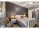 Inviting main bedroom showcases a relaxing sitting area, plush carpet, and a calming color palette at 4413 W Phalen Dr, New River, AZ 85087