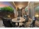 Covered patio with outdoor seating, an outdoor TV, and desert landscaping at 4413 W Phalen Dr, New River, AZ 85087