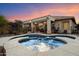 Backyard pool and covered patio with outdoor seating, perfect for relaxing or entertaining guests at 4413 W Phalen Dr, New River, AZ 85087