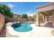 Backyard pool with waterfall feature at 4413 W Phalen Dr, New River, AZ 85087