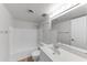 Well-lit bathroom with single sink vanity, tub, and shower combo at 4630 N 68Th St # 280, Scottsdale, AZ 85251