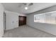 Bright bedroom with carpet, closet, and window with blinds at 4630 N 68Th St # 280, Scottsdale, AZ 85251
