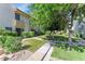 Inviting condo exterior with lush landscaping, sidewalks and well-maintained greenery at 4630 N 68Th St # 280, Scottsdale, AZ 85251