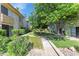Inviting condo exterior with lush landscaping, sidewalks and well-maintained greenery at 4630 N 68Th St # 280, Scottsdale, AZ 85251