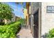 Charming patio with seating and privacy hedges near the front door at 4630 N 68Th St # 280, Scottsdale, AZ 85251