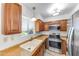 Modern kitchen with stainless steel appliances, wood cabinets, and lots of light at 4630 N 68Th St # 280, Scottsdale, AZ 85251