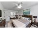 Stylish main bedroom with a ceiling fan, mirrored closet, and a large king bed at 4630 N 68Th St # 280, Scottsdale, AZ 85251