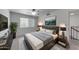 Comfortable main bedroom with a modern design, ceiling fan, and lots of natural light at 4630 N 68Th St # 280, Scottsdale, AZ 85251