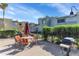 Outdoor patio area featuring a table with chairs, grill, and lush green landscaping at 4630 N 68Th St # 280, Scottsdale, AZ 85251