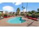 Sparkling community pool with lounge chairs for relaxing by the water under palm trees at 4630 N 68Th St # 280, Scottsdale, AZ 85251