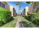Scenic condo walkway surrounded by mature landscaping and well-maintained lawns at 4630 N 68Th St # 280, Scottsdale, AZ 85251