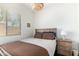 Bedroom with natural light, cozy bed, and classic bedside table at 4662 S Calico Rd, Gilbert, AZ 85297