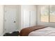 Bedroom with neutral colors, window with blinds, and closet at 4662 S Calico Rd, Gilbert, AZ 85297