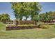 Elegant stone sign for the 'Ranch House Clubhouse & Park,' with manicured landscaping at 4662 S Calico Rd, Gilbert, AZ 85297