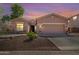 Charming single-story home featuring a three-car garage and desert landscaping at 4662 S Calico Rd, Gilbert, AZ 85297