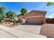 Charming home exterior with a well-maintained lawn and attached garage at 4662 S Calico Rd, Gilbert, AZ 85297
