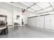 Spacious garage with epoxy floor, abundant storage, and a convenient side entrance at 4662 S Calico Rd, Gilbert, AZ 85297
