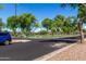 Community green space with manicured lawn and mature trees, perfect for outdoor activities at 4662 S Calico Rd, Gilbert, AZ 85297
