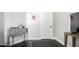 Hallway featuring a stylish console table and sleek dark wood flooring at 4662 S Calico Rd, Gilbert, AZ 85297