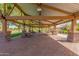 Community pavilion with picnic tables, offering a shaded space for gatherings at 4662 S Calico Rd, Gilbert, AZ 85297
