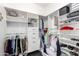 Organized walk-in closet with shelves, drawers, and hanging rods for ample storage at 4662 S Calico Rd, Gilbert, AZ 85297