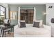 Comfortable bedroom with a daybed, natural light, and side table at 5302 E Van Buren St # 2024, Phoenix, AZ 85008