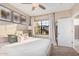 Bright bedroom with a large window, plush carpeting, and neutral decor at 5302 E Van Buren St # 2024, Phoenix, AZ 85008