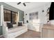 Comfortable bedroom featuring a built-in daybed, stylish decor, and ample natural light at 5302 E Van Buren St # 2024, Phoenix, AZ 85008