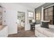 Bedroom featuring daybed, natural light and closet with mirrored doors at 5302 E Van Buren St # 2024, Phoenix, AZ 85008