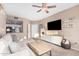 Open-concept living space with a view to the kitchen, comfortable seating, and a large TV at 5302 E Van Buren St # 2024, Phoenix, AZ 85008