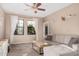 Comfortable living area with lots of natural light, ceiling fan and neutral tones at 5302 E Van Buren St # 2024, Phoenix, AZ 85008