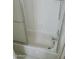 Bathroom tub and shower with glass doors at 5704 E Aire Libre Ave # 1038, Scottsdale, AZ 85254